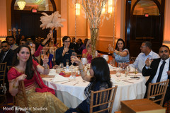 Indian wedding guests making a toast indian wedding reception,indian wedding reception photography