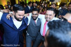 Cheerful indian groom with groomsmen moment indian wedding reception,indian wedding reception photography,indian groom,indian groomsmen