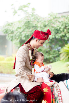 Indian groom with little kid riding horse Indian groom with little kid riding horse