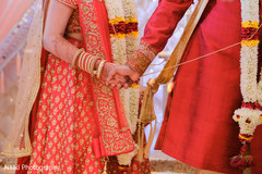 Lovely indian couple holding hands close-up Lovely indian couple holding hands close-up
