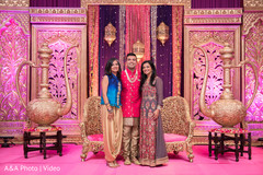 Indian groom posing with sangeet guests Indian groom posing with sangeet guests