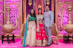 Indian bride's portrait with sangeet guests Indian bride's portrait with sangeet guests