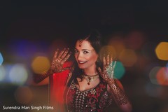 Indian bride showing mehndi art Indian bride showing mehndi art