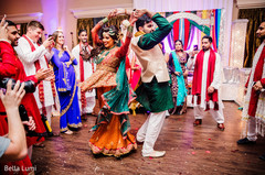 Lovely indian couple dancing during sangeet Lovely indian couple dancing during sangeet
