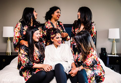 Indian bride having fun with bridesmaids Indian bride having fun with bridesmaids