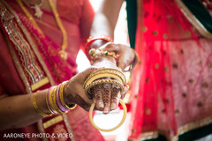 Indian bride being helped to get ready Indian bride being helped to get ready