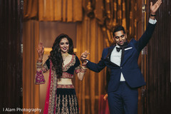 Lovely indian couple making their entrance to wedding reception