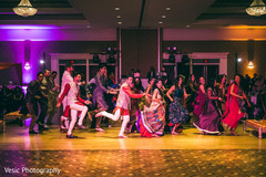 All guests dancing at sangeet sangeet,pre wedding celebrations,indian wedding venue