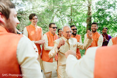 Indian groom's father dancing during baraat Indian groom's father dancing during baraat