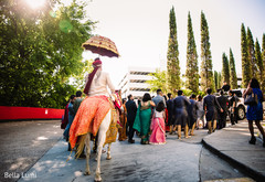 Indian groom escorted by friends and family. Indian groom escorted by friends and family.
