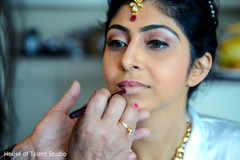 Beautiful indian bride being dolled up for her ceremony Beautiful indian bride being dolled up for her ceremony