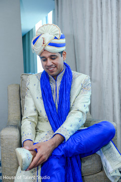 Indian groom putting shoes on Indian groom putting shoes on