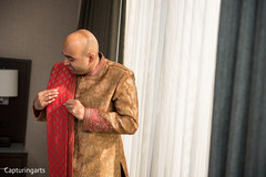 Indian groom preparing his wedding outfit. Indian groom preparing his wedding outfit.