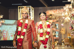 Joyful indian couple walking down the aisle Joyful indian couple walking down the aisle