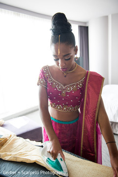 Lovely Indian bridesmaid helping the groom to get ready. Lovely Indian bridesmaid helping the groom to get ready.