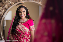 Indian bride glowing in her wedding attire. Indian bride glowing in her wedding attire.