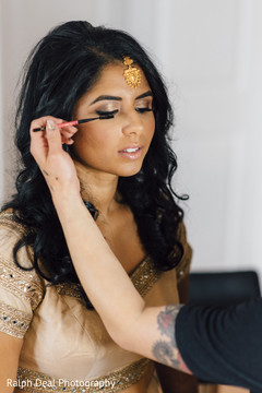 Beautiful indian bride being dolled up for her ceremony Beautiful indian bride being dolled up for her ceremony