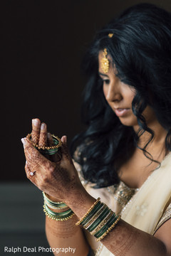 Indian bride putting wedding jewerly on Indian bride putting wedding jewerly on