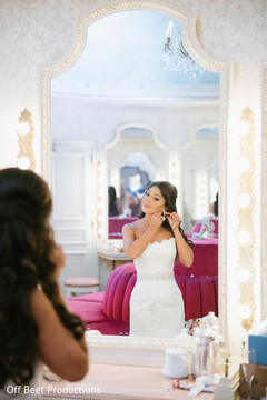 Maharani glowing in her white wedding dress.