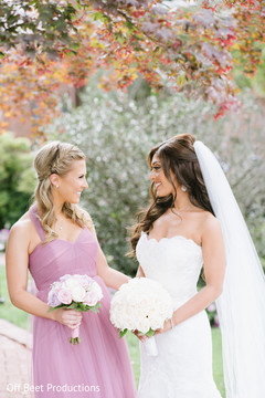 Glowing Indian bride and bridesmaid.