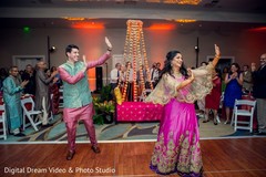 Indian bride and groom dancing Indian bride and groom dancing