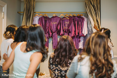 Indian bridal party checking their personalized robes Indian bridal party checking their personalized robes