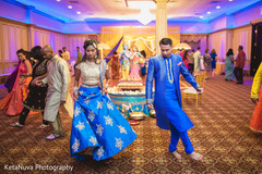 Indian couple dancing at their sangeet indian bride fashion,indian groom fashion,garba
