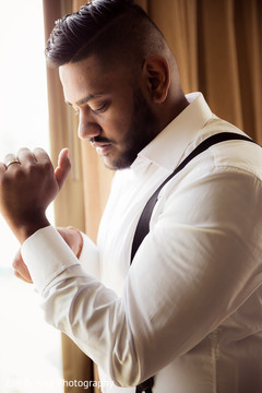 Candid shot of Indian groom getting ready. Candid shot of Indian groom getting ready.