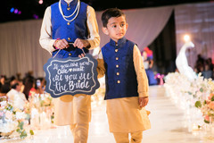 Cutest Indian wedding sign bearer boys. Cutest Indian wedding sign bearer boys.