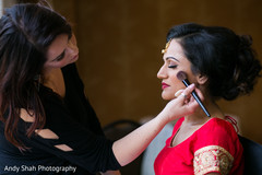 Lovely bride getting her makeup done Lovely bride getting her makeup done