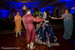 Enchanting indian couple dancing during sangeet Enchanting indian couple dancing during sangeet