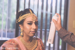 Final touch ups to the bridal look. Final touch ups to the bridal look.