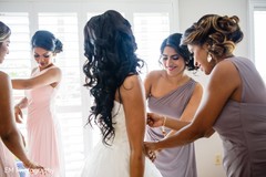 Indian bridesmaids helping the bride to get ready. Indian bridesmaids helping the bride to get ready.
