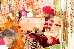 Traditional Indian couple exchanging rings. Traditional Indian couple exchanging rings.