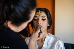 Lovely bride getting her makeup done Lovely bride getting her makeup done