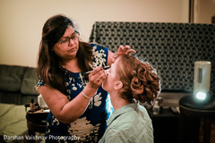 Lovely bride getting her makeup done Lovely bride getting her makeup done