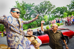 Indian groom being lifted up during baraat Indian groom being lifted up during baraat