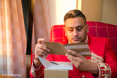 Emotional Indian groom reading message from the bride. Emotional Indian groom reading message from the bride.