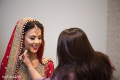 Beautiful indian bride being dolled up for her ceremony Beautiful indian bride being dolled up for her ceremony