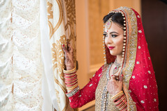 Adorable indian bride looking out the window Adorable indian bride looking out the window