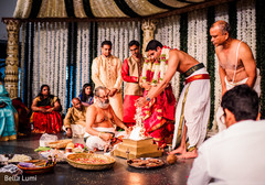 See this couple lighting the sacred fire See this couple lighting the sacred fire
