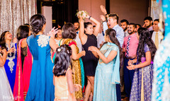 Indian wedding guest catching the bouquet bridal bouquet,indian wedding,sari