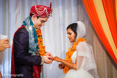 Indian bride and groom exchanging vows. Indian bride and groom exchanging vows.