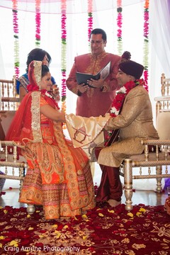 Indian bride and groom exchanging vows. Indian bride and groom exchanging vows.