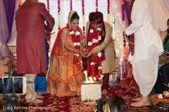 Indian couple lightning the sacred fire. Indian couple lightning the sacred fire.