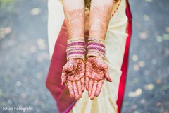 Beautiful indian bride showing henna art Beautiful indian bride showing henna art