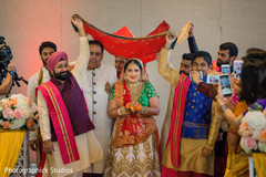 Indian bride under a red canopy. Indian bride under a red canopy.