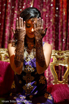 Indian bride showing mehndi art Indian bride showing mehndi art