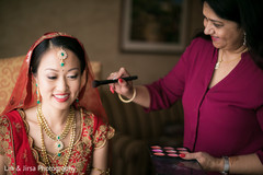 Lovely bride getting her makeup done Lovely bride getting her makeup done