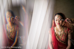 Beautiful indian bride being dolled up for her ceremony Beautiful indian bride being dolled up for her ceremony
